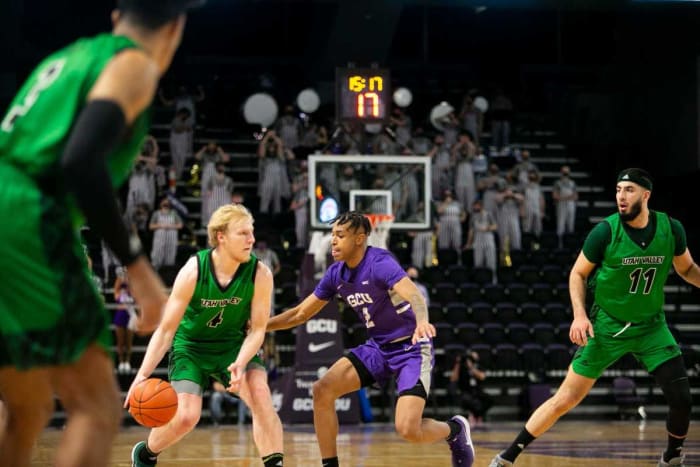 March 6, 2021; Phoenix, AZ, USA; Grand Canyon's guard Chance McMillian (2) guards Utah Valley's guard Trey Woodbury (4) at Grand Canyon University Arena on March 6, 2021. Credit: Meg Potter/The Arizona Republic Gcu V Utah Valley